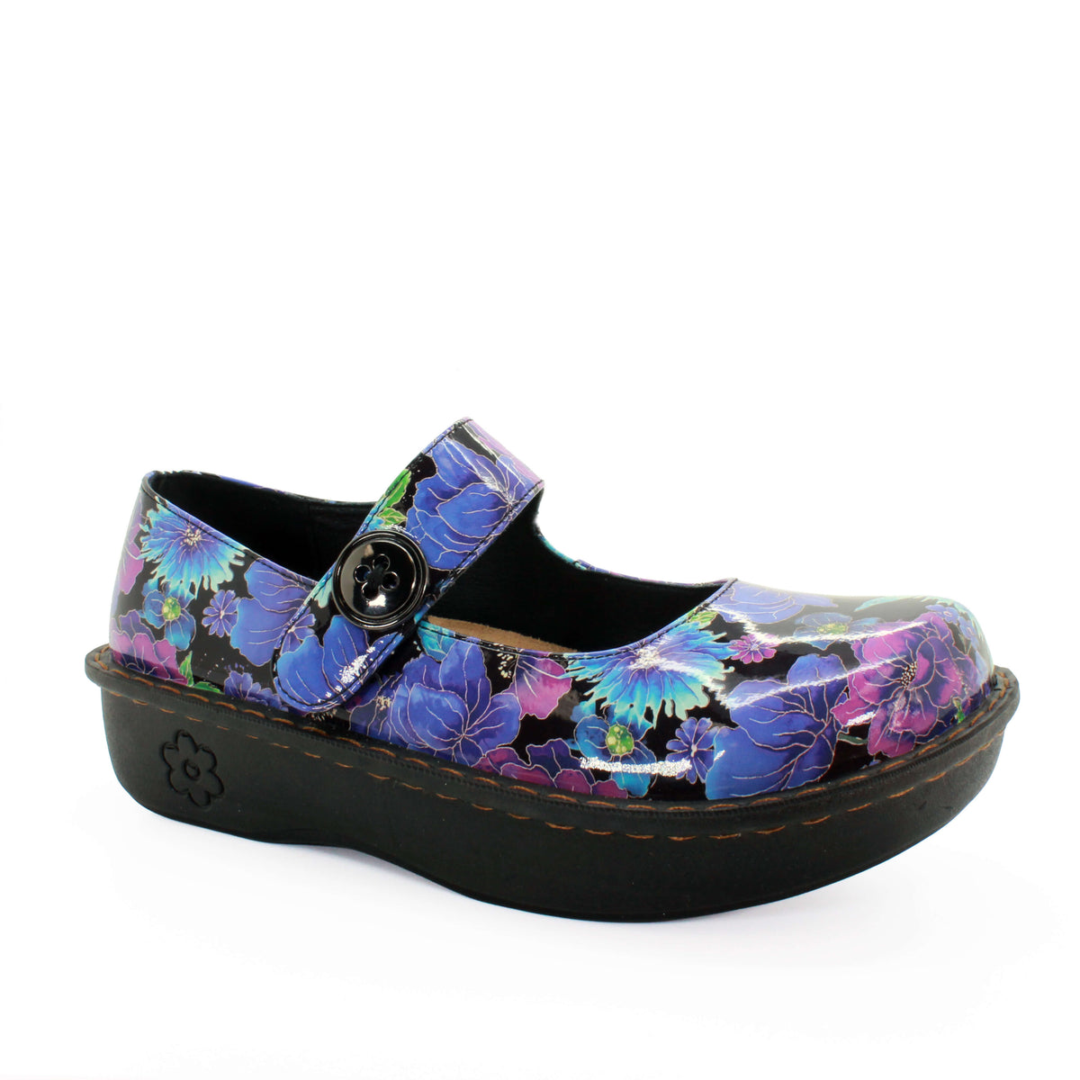 Floral patterned shoe with a black sole on a white background