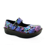 Floral patterned shoe with a black sole on a white background