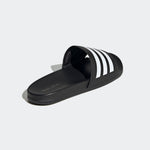 Black slide sandal with white stripes on a light gray background
