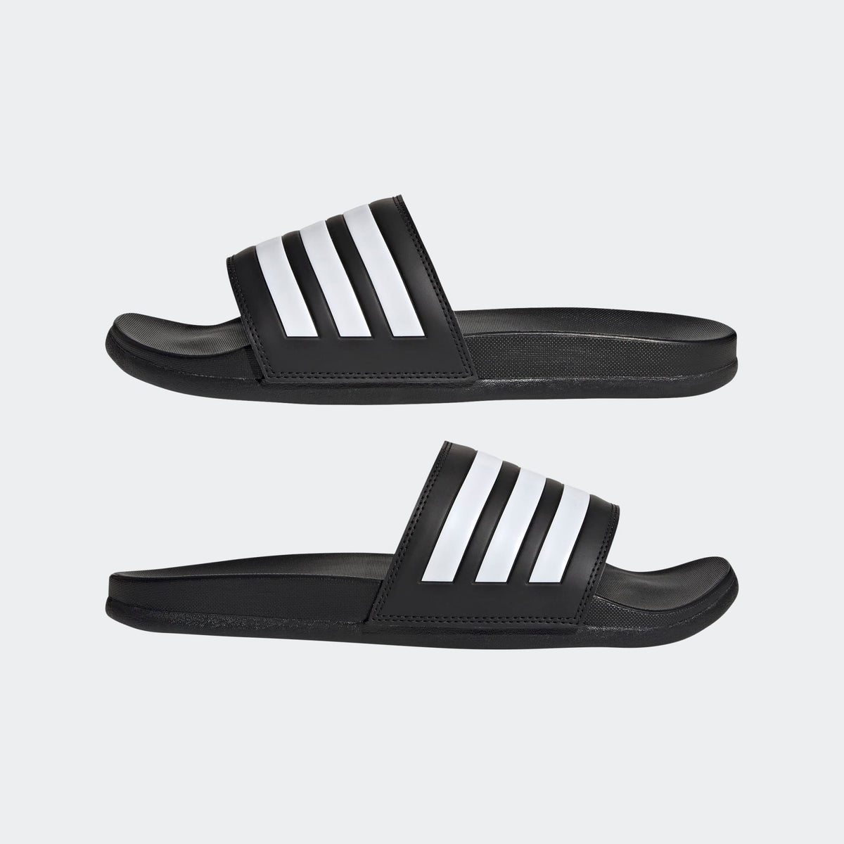Black slides with white stripes on a light gray background